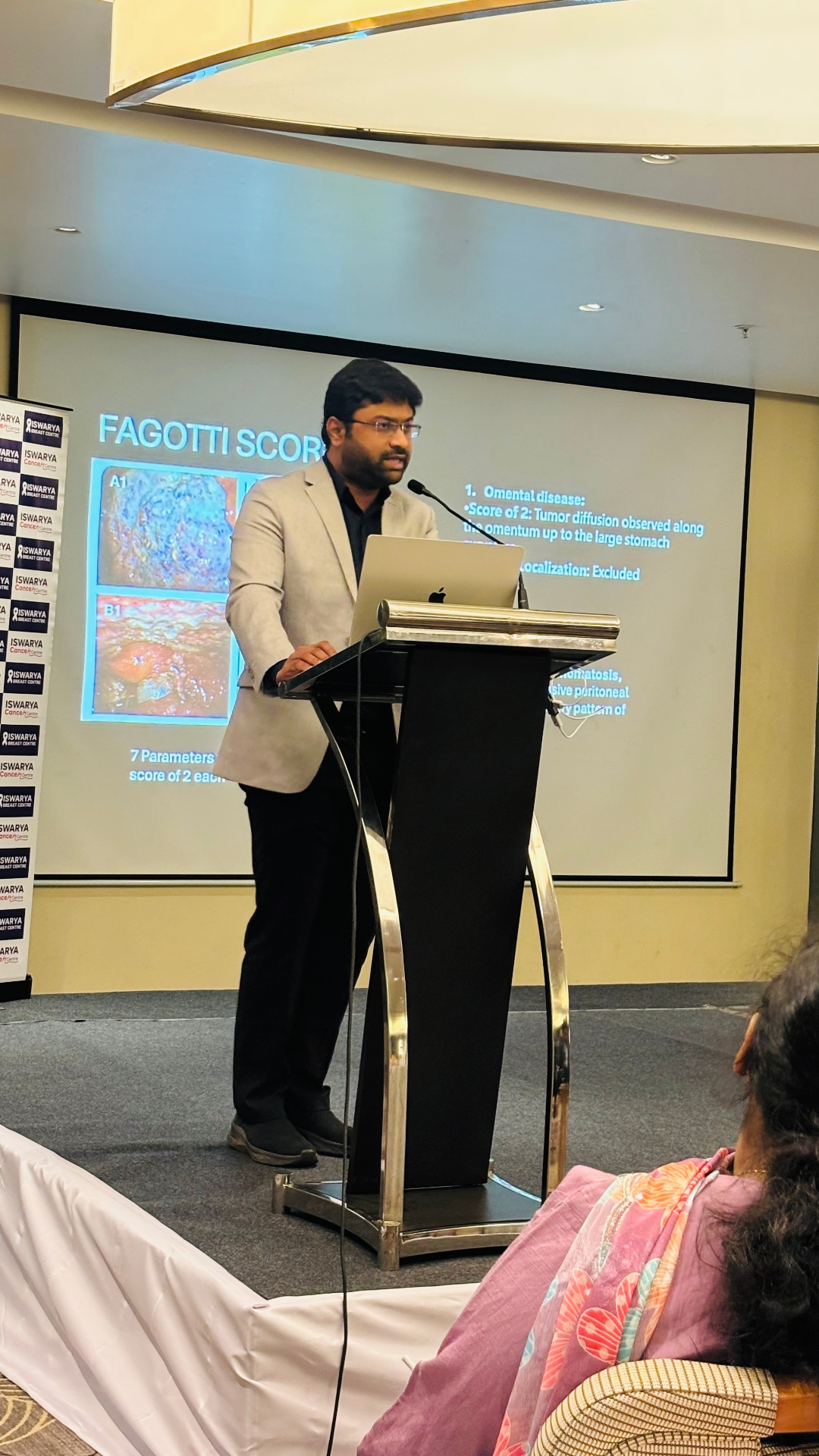 Dr. Ruthrendhra E presenting research at an oncology conference